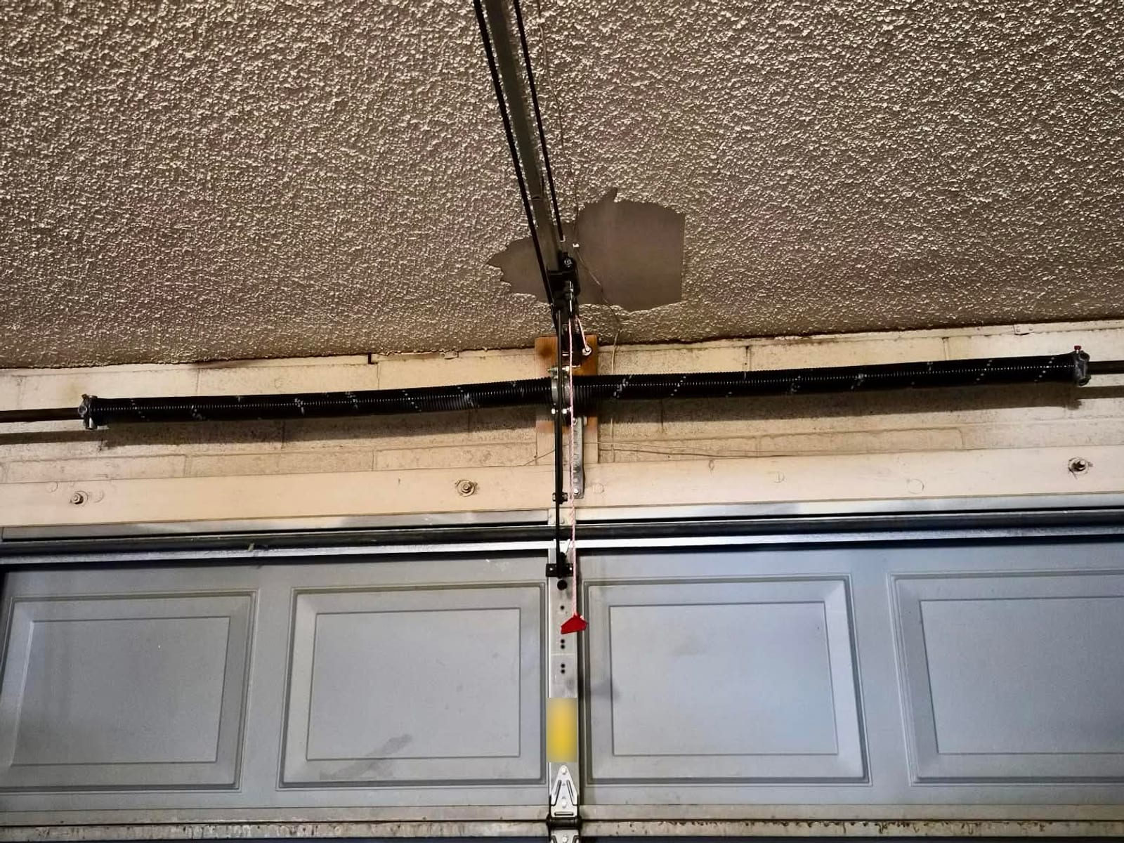After: new torsion spring installed above the garage door in Mesa
