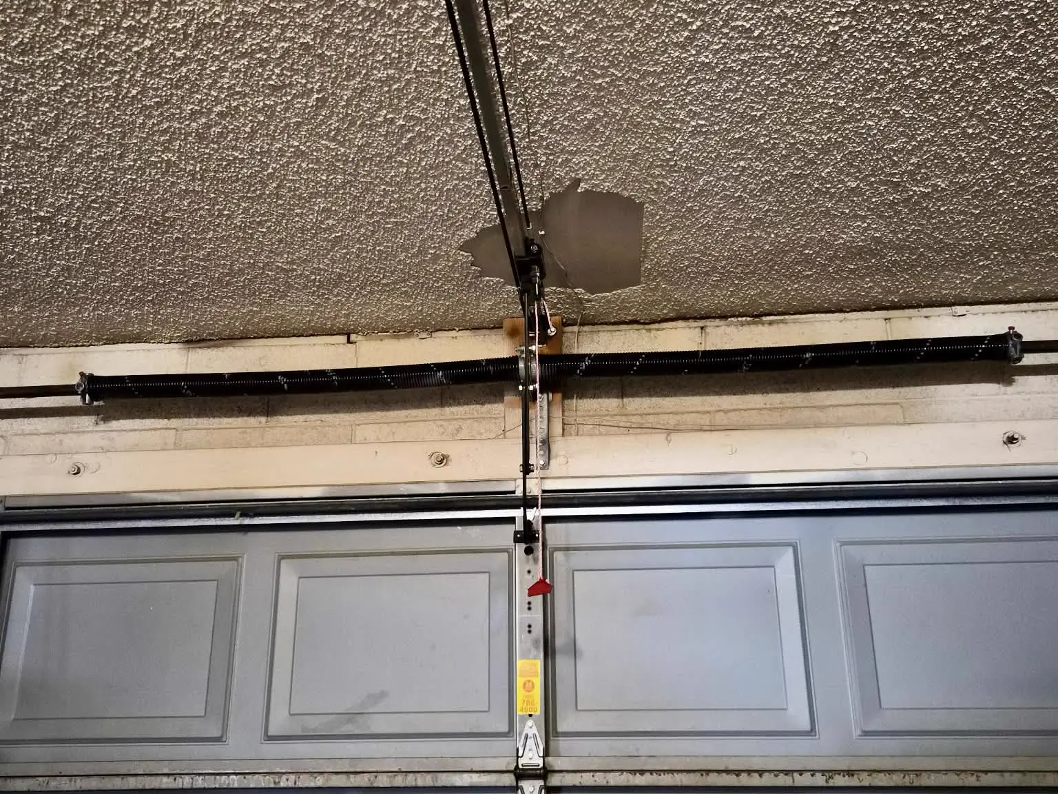 After: new torsion spring installed above the garage door in Mesa