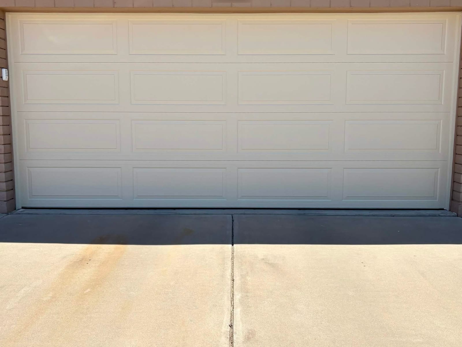 New steel-back insulated long-panel garage door after installation in Apache Junction, AZ