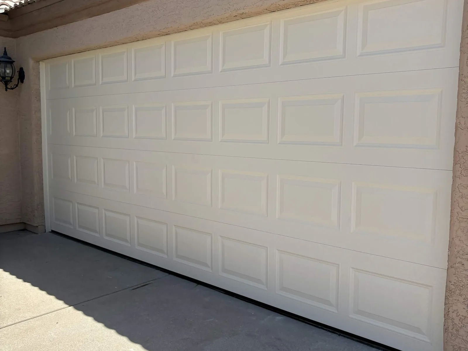 After: new insulated almond short-panel garage door with fresh weather seal in Alta Mesa
