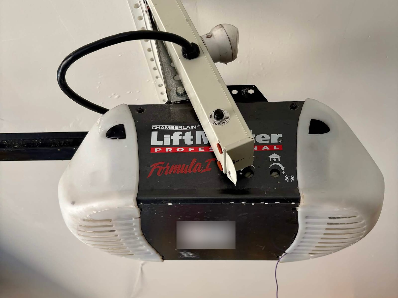 Before: aging Chamberlain LiftMaster Formula I garage door opener in Mesa