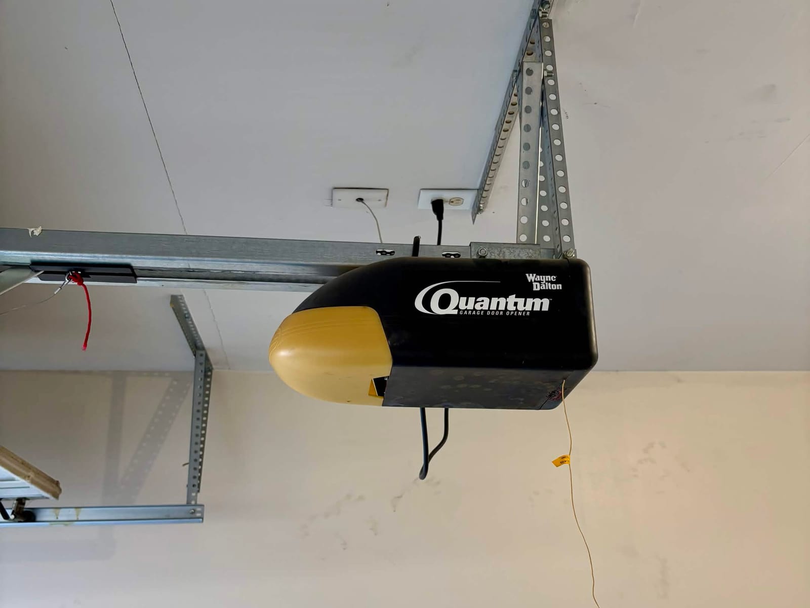 Before: 21-year-old Wayne Dalton Quantum garage door opener on its rail, no longer able to lift the door, in Phoenix